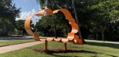 Hank Willis Thomas sculpture in a green space